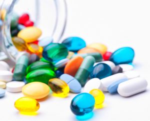 Pills spilling from a jar